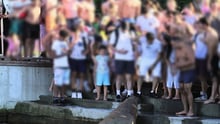 A walrus surrounded by human onlookers